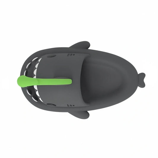 A top-down view of a single gray Cloudsharks shark slide, highlighting the sleek silhouette and the bright green lantern-style fin.