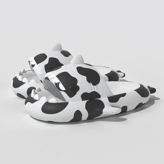 Cow Cloudshark Slides - fun black and white cow pattern sandals with shark teeth design from cloudsharks.shop
