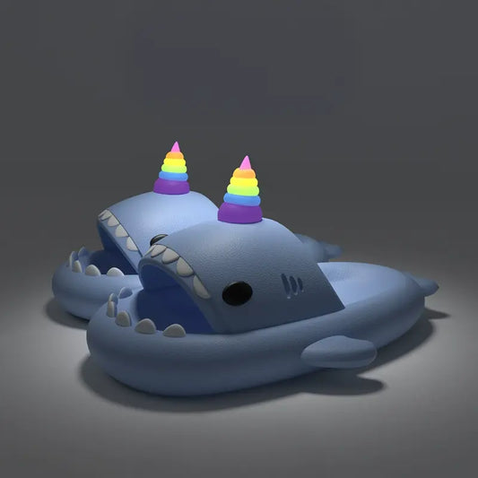 Explore Blue Unicorn Shark Slides featuring playful shark teeth and rainbow unicorn horns. Available now at Cloudsharks.shop.