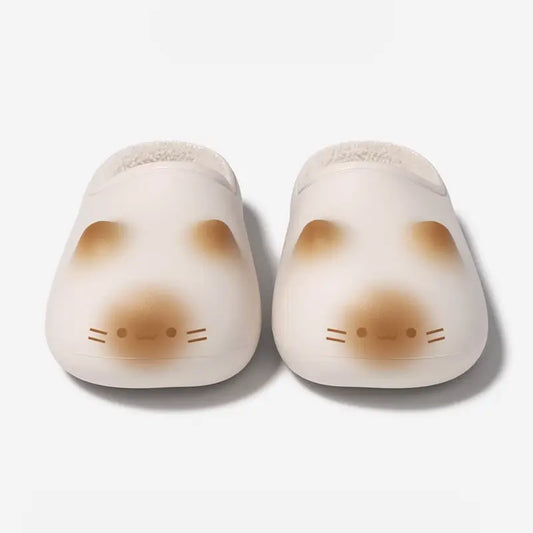 Top-down pair of Cloudsharks Friends cat paw slippers in beige with adorable cat face design, furry lining, and extra-thick cloud cushion sole for all-day home comfort