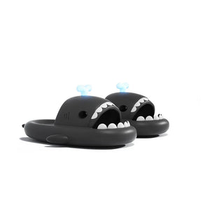 Black Cloudsharks shark slides with playful whale spouting glow-in-the-dark fins and bold shark teeth.