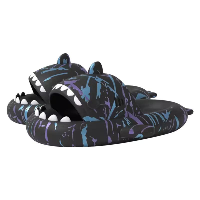 Pair of black Cyberpunk Shark Slides with striking blue and purple splatter accents, emphasizing the bold shark design and durable EVA construction. A must-have for cyberpunk enthusiasts.