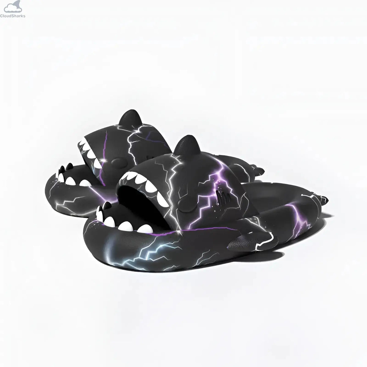 Side-angle view of a pair of black Lightning Shark Slides highlighting the 4cm thick cushioned EVA sole, 3D shark fins, and electric bolt graphic.
Front-facing pair view showing both black Lightning Shark Slides with open shark mouths, white teeth, and symmetrical electric lightning patterns.