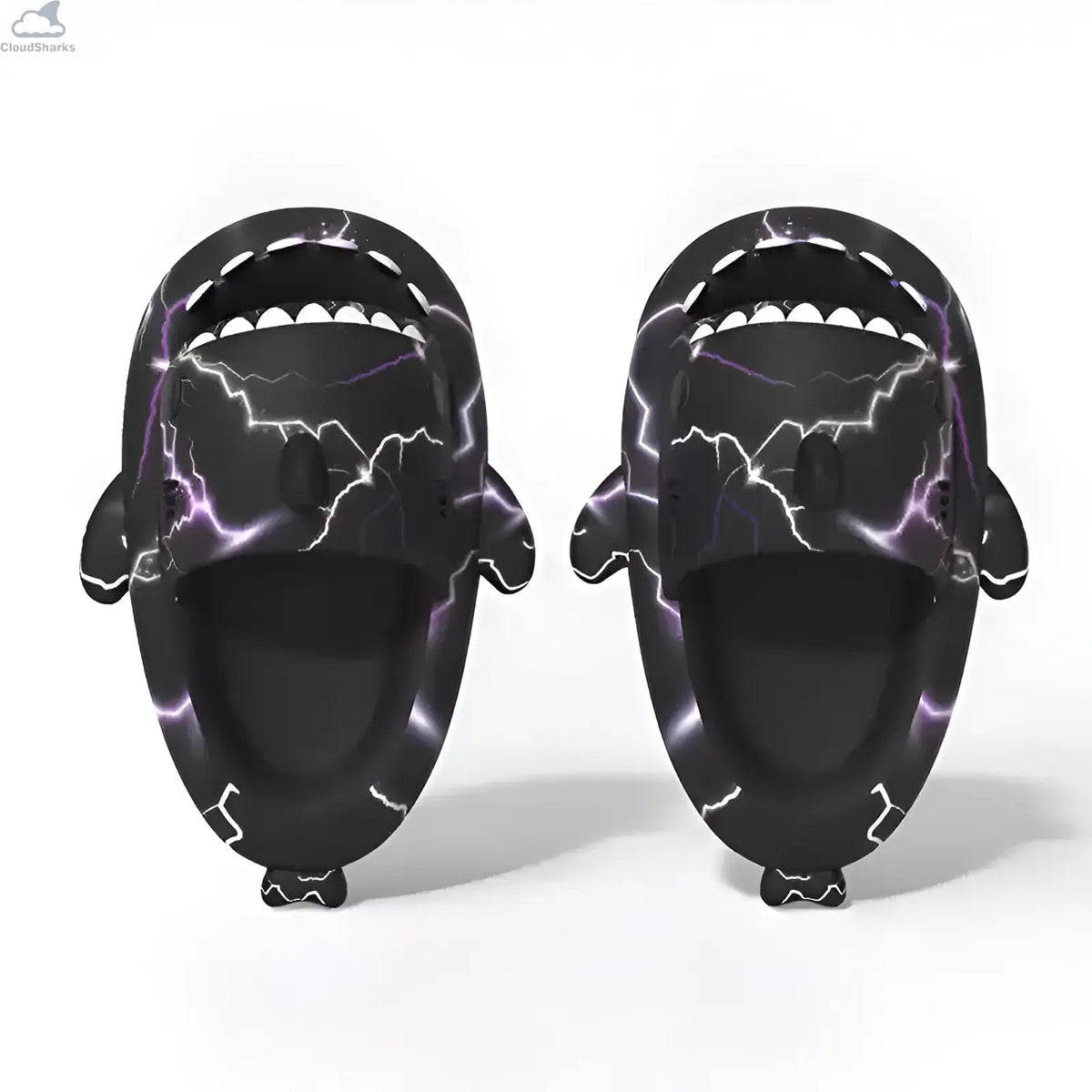 Front view of a pair of black Lightning Shark Slides with electric purple lightning print, open shark mouth design, and white teeth details.
Perspective angle view of a pair of black Lightning Shark Slides showcasing the 4cm thick EVA cloud sole, 3D dorsal fin, side fins, and lightning artwork.