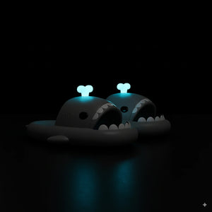 Black Cloudsharks whale shark slides with glowing blue whale spouting fins in the dark.
