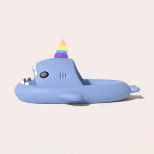 Side view of a light blue Unicorn Shark Slide featuring a vibrant rainbow unicorn horn. The slide has a matte, slightly textured EVA finish, showcasing its playful design and smooth contours.