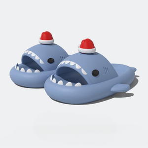 Pair of blue cloudsharks with white teeth and a festive red and white Santa hat on the fin, against a white studio background.