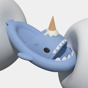 A single blue CloudSharks Ice Scream Shark Slide being bent to showcase its soft and flexible design, perfect for all-day comfort.