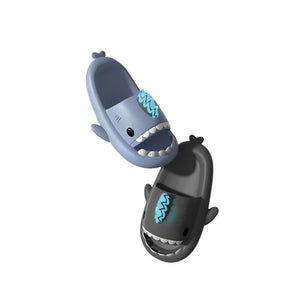 Pair of Cloudsharks slides with glow-in-the-dark Fire Fin Charms, the ultimate shark slides accessories for unique customization.