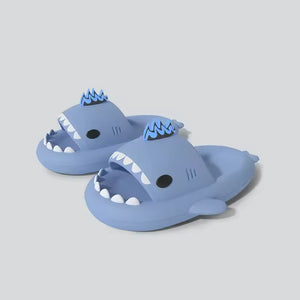 Blue cloudsharks shark slides with glow in the dark fins, kaiju shark slippers featuring soft EVA sole and cute shark design for indoor outdoor wear