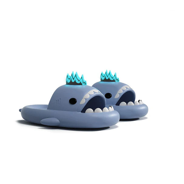 Blue cloudsharks shark slides with glow in the dark blue fins, soft EVA shark slippers featuring kaiju shark design for indoor outdoor comfort