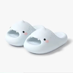 Cloudsharks™ Shark Slides in white, featuring a cute shark face with fins and teeth. A matching pair of fun and comfortable shark slippers for all ages.