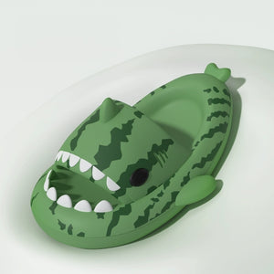 Angled front view of Cloudsharks™ Watermelon Shark Slides with playful shark teeth and fin design.