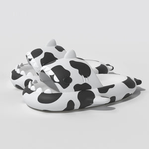 Cow Cloudshark Slides - fun black and white cow pattern sandals with shark teeth design from cloudsharks.shop