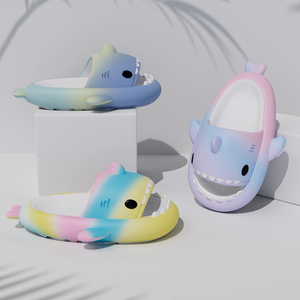 Three gradient shark slides in different color combinations (blue/green, pink/blue/purple, yellow/pink/blue), displayed on white blocks. Emphasizes the diverse vibrant ombre options and shark design.