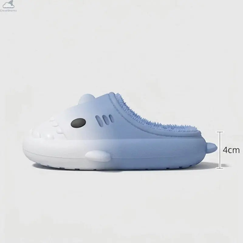 A light blue and white silicone slip-on shoe with a shark design, featuring a textured blue lining and a height measurement indicator showing 4cm.