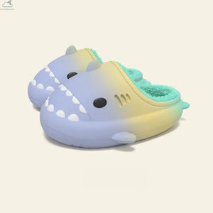 Pair of pastel blue and yellow gradient shark slides featuring plush mint green fleece lining, non-slip cloudsharks waterproof slippers. A pair of Gradient Winter Shark Slides featuring a blue-to-yellow outer body with mint green plush fleece lining resting on a neutral background.