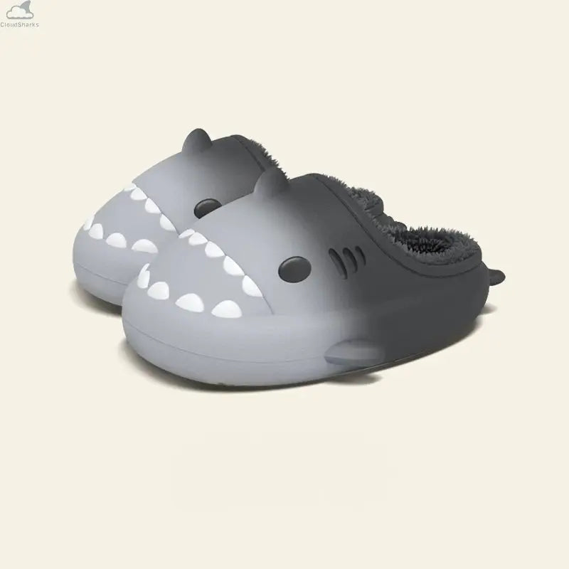 Pair of light grey to dark charcoal gradient shark slippers with dark plush fleece lining, cloudsharks non-slip house slides. A pair of Gradient Winter Shark Slides in a monochrome light-grey-to-dark-charcoal gradient with matching dark grey plush lining.
