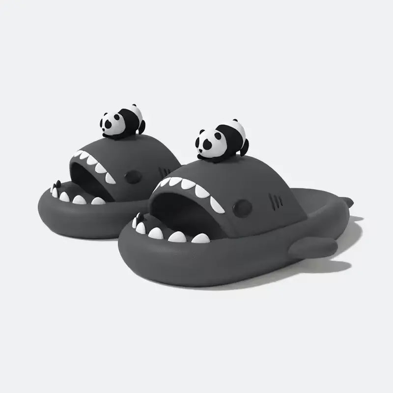 Pair of grey Panda Shark Slides featuring the iconic shark shape, white teeth, and a small panda charm, available at cloudsharks.shop. Durable, non-slip, and perfect for indoor outdoor slides.