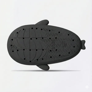 Bottom sole view of black shark slides featuring anti-slip tread pattern, grip texture, and durable weatherproof material.