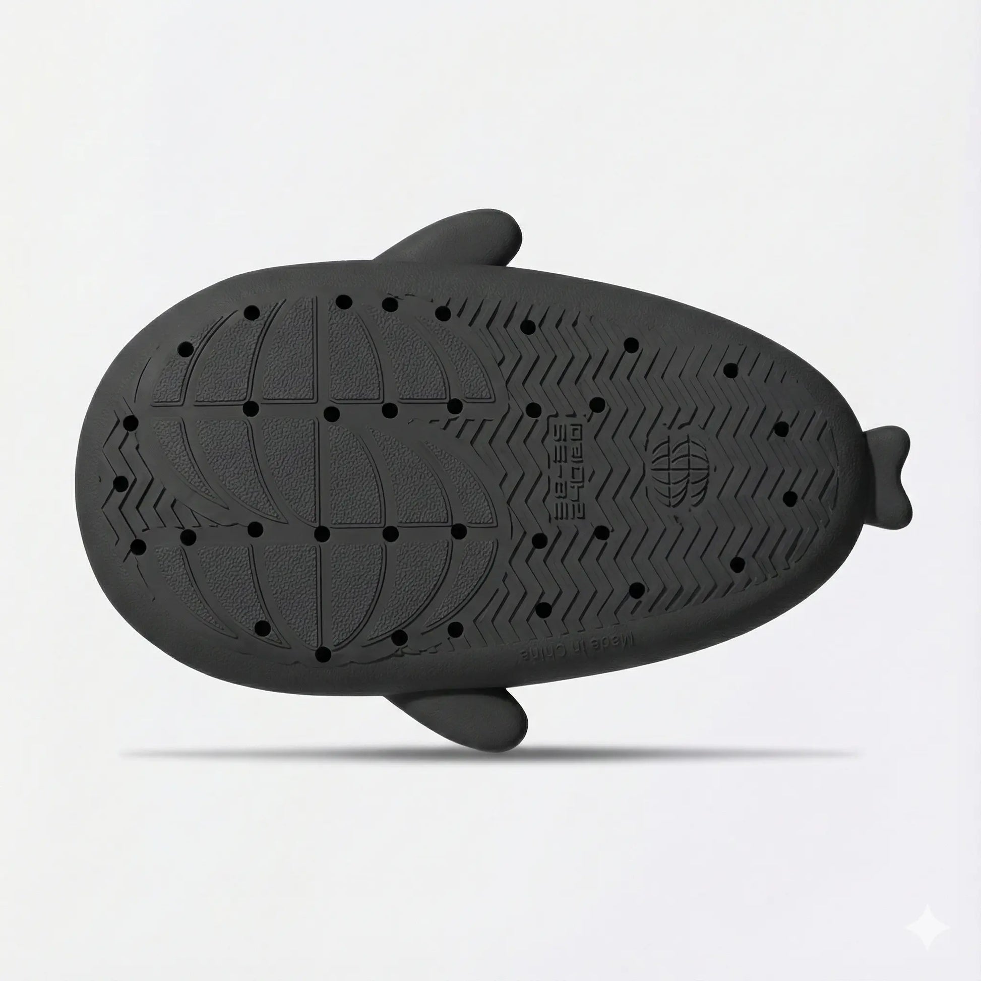 Bottom sole view of black shark slides featuring anti-slip tread pattern, grip texture, and durable weatherproof material.