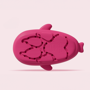 The bottom sole of a pink Cloudshark shark slide, showing the fishbone-patterned anti-skid texture and drainage holes designed for safety and grip on wet surfaces.