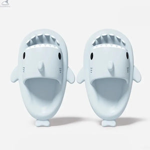 Top-down view of light ice blue Original Shark Slides featuring shark teeth and side fins.