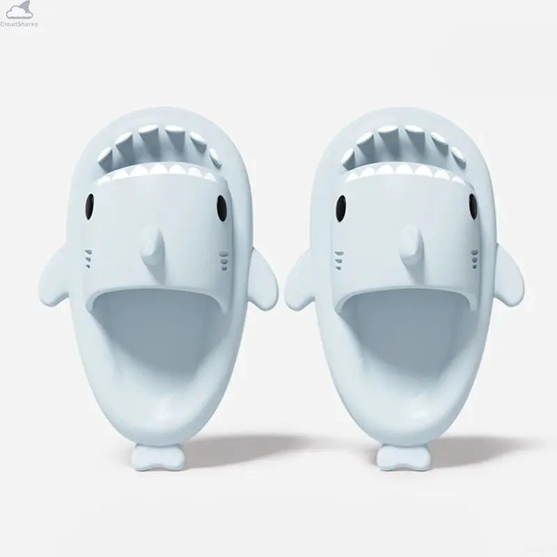 Top-down view of light ice blue Original Shark Slides featuring shark teeth and side fins.