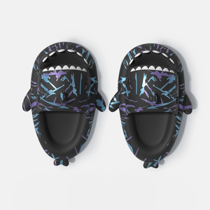 Top view of a pair of black Cyberpunk Shark Slides, highlighting the intricate blue and purple splatter patterns and the detailed shark head design, offering both style and comfort.