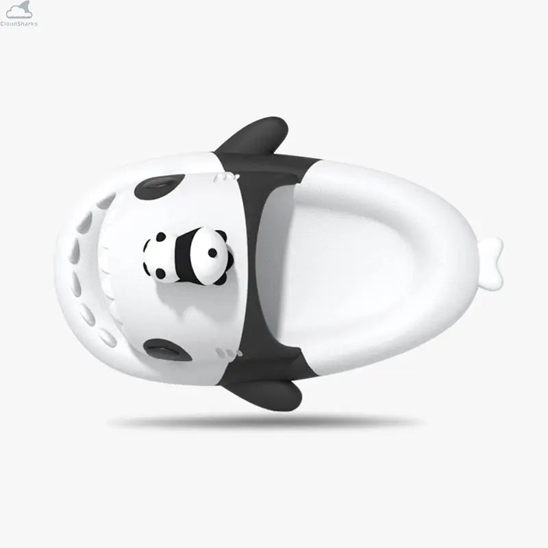 Top view of black and white Cloudsharks Panda Family Shark Slippers showcasing the ergonomic footbed, side fins, shark snout teeth, and mini panda head design. Top-down perspective of the Panda Family Shark Slides displaying the inner footbed, shark fins, panda eye patches, and shark teeth.