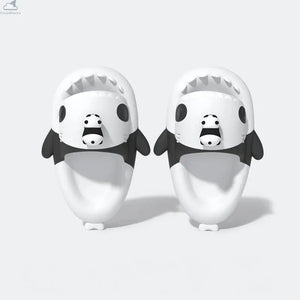 Top-down view of black and white Cloudsharks Panda Family Shark Slippers featuring cute 3D mini panda toppers, panda eye patches, and ergonomic footbeds. Top-down view of the pair of Panda Family Shark Slides featuring 3D mini pandas attached on top of the shark heads with black panda eye patches.