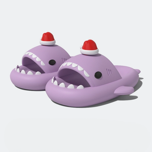 Pair of lavender/light purple shark slippers with a fun Santa hat detail, on a white studio background.
