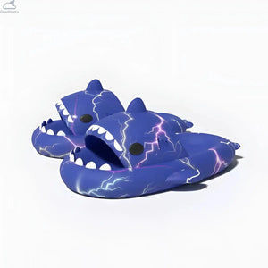 Perspective angle view of a pair of royal blue Lightning Shark Slides featuring bright purple and white electric lightning strikes and white teeth.
Perspective view of royal blue Lightning Shark Slides with electric purple lightning pattern, open shark mouth, and 4cm cushioned cloud slides sole.