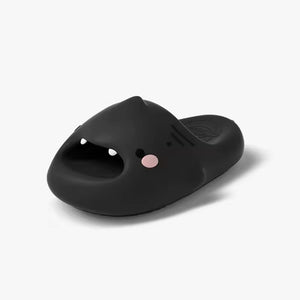 Black Sharky Slides featuring a cute shark face with pink cheeks, perfect for casual wear.