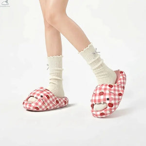 Model wearing cute pink gingham Sharky Apple shark slides with socks for cloudsharks daily style