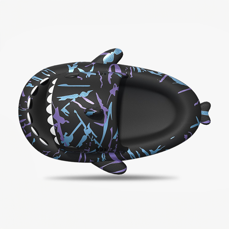 Top-down view of a single black Cyberpunk Shark Slide, showcasing its distinctive shark shape and vibrant blue and purple splatter patterns on the comfortable sole.
