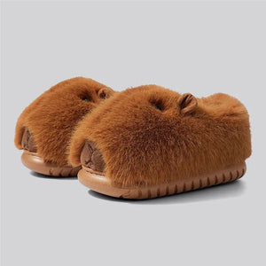 Side view of Sleepy Capybara plush slippers from cloudsharks.shop with fluffy brown fur and EVA sole, cute animal indoor outdoor slippers for cozy home wear