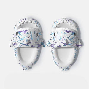 Overhead view of white Cyberpunk Shark Slides featuring vibrant blue and purple splatter patterns, highlighting the shark head design and comfortable footbed. Perfect for indoor or outdoor style.