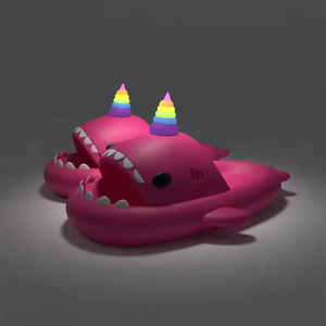 Shop Pink Unicorn Shark Slides with vibrant rainbow horns and shark-like details. Perfect for fun and comfort at Cloudsharks.shop.