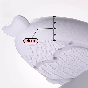 Close-up bottom view of a white Cosmic Shark Slide sole, with a graphic overlay indicating a 4cm thickness. The sole features a textured anti-slip pattern, highlighting its cushioning and support.