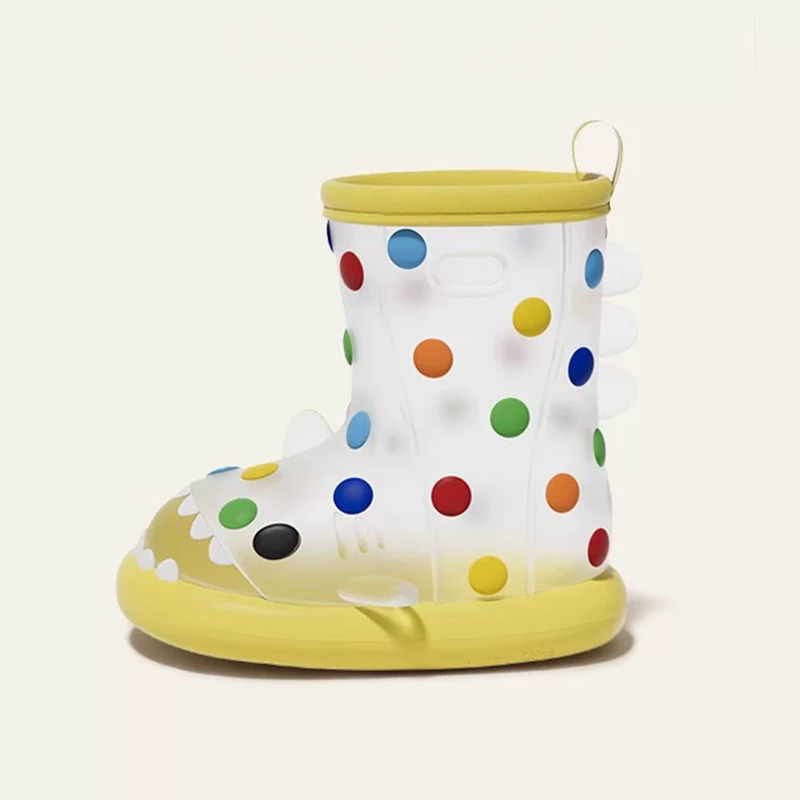 Bright yellow rainbow dot shark rain boots for toddlers, featuring fun polka dots, shark fin spikes, pull tab, and soft cushioned insole for comfort.
