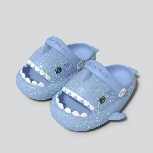 Blue Cloudsharks shark slippers for kids – glow in the dark children’s slides with smiling shark face and soft cushion sole